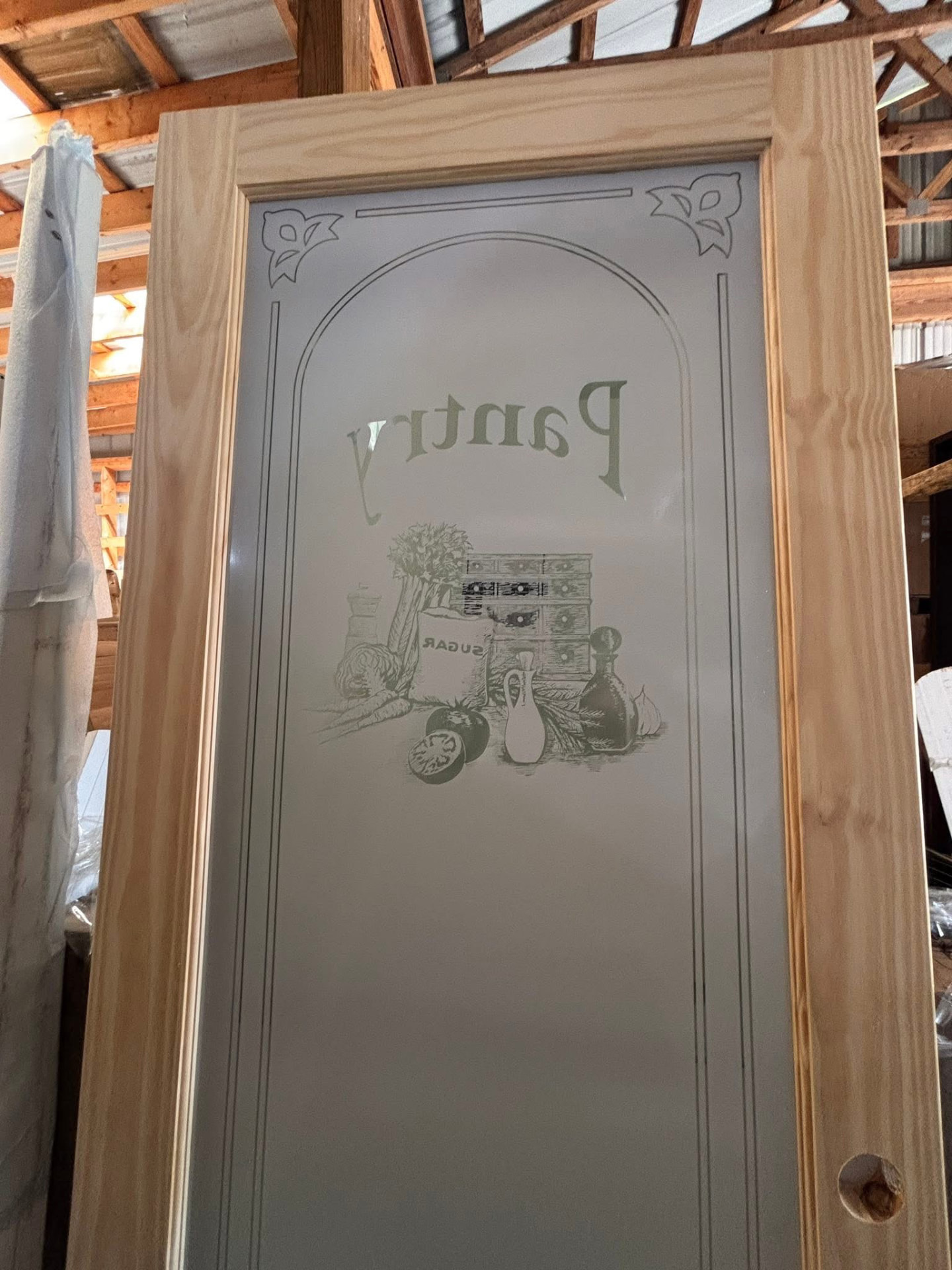 New pine-framed interior pantry door with a frosted etched glass panel